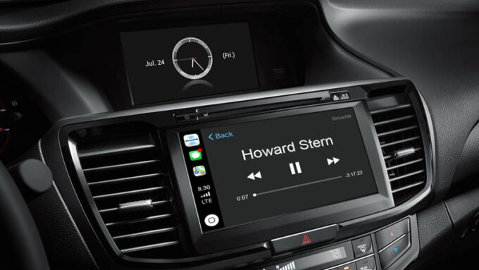 An audio system screen with Apple CarPlay